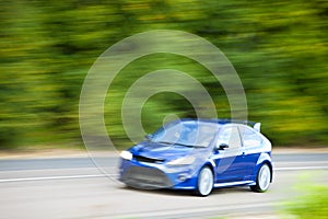 Car driving down country road