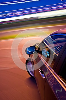 Car driving fast photo