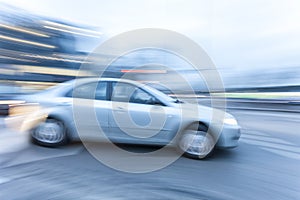 Car driving fast on country road