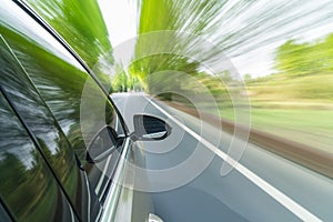 Car driving with fast motion blur