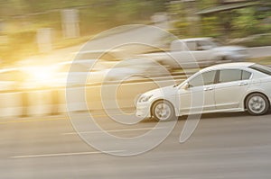 Car driving fast motion on highway side view, Fast white cars on highway