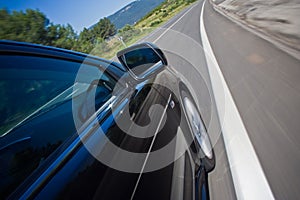 Car driving fast on a road