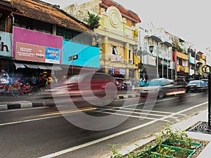 Car driving fast through small streets