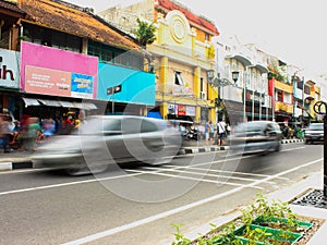 Car driving fast through small streets