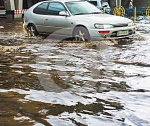 Car driving flood city road