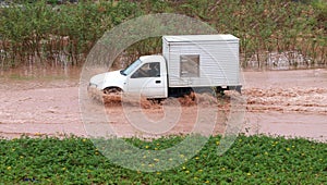 Car driving in flooding road