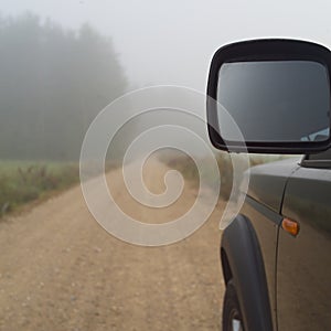 Car driving in fog