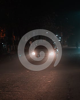 Car driving in fog . Headlight through fog . Night shot. Driving car.