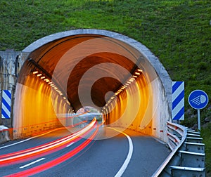 Car driving at high speed through a tunnel