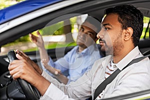 car driving instructor talking to man failed exam