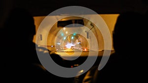 Car driving interior into tunnel