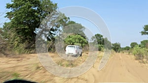Car driving on main road road to Okavango