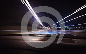 A car driving on a motorway at high speeds.