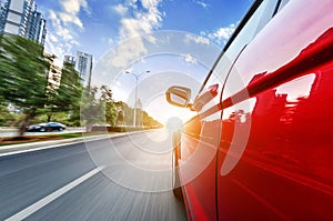 A car driving on a motorway at high speeds photo