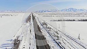 A car driving on a motorway in winter in a mountainous area