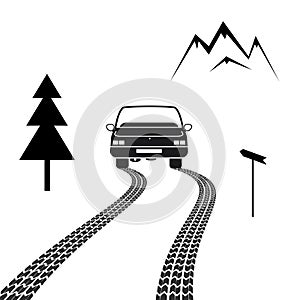 Car driving on a mountain road with tire tracks