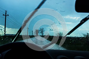 Car driving in rain