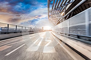 Car driving on road in city background, motion blur