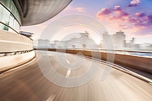 Car driving on road in city background, motion blur