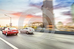 Car driving on road, motion blur