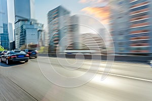 Car driving on road, motion blur