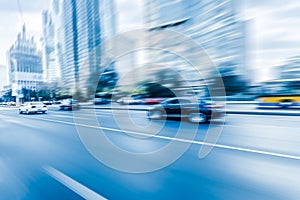 Car driving on road, motion blur