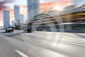 Car driving on road, motion blur