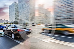 Car driving on road, motion blur