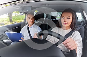 car driving school instructor and young driver