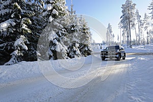 Car driving on snowy roads