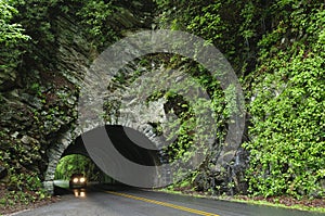 Car driving through tunnel
