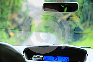 Car driving, view from inside on dashboard