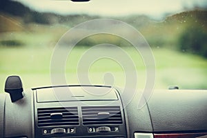 Car driving, view from inside on dashboard