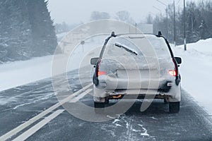Car is driving on a winter road