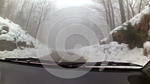 Car driving through winter weather conditions