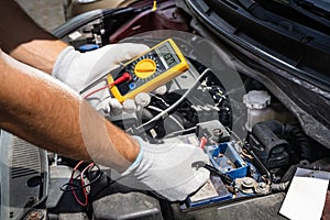 Car Electronic Maintenance Service And Check. Worker Man