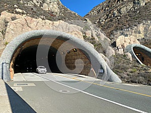 Car emerging from Devil`s Slide Tunnel