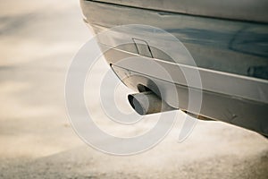 Car emission smoke out exhaust pipe
