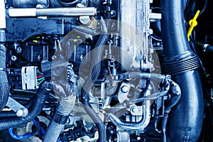 Car engine. Car engine part. Close-up image of an internal combustion engine. Engine detailing in a new car. Car detailing.