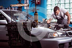 Car engine hanging in garage