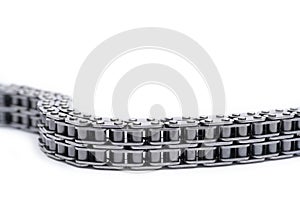 Car engine timing chain close-up isolated on white background.