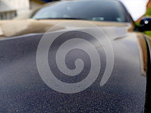 Car in Europe covered in Sahara sand transported from North Africa by southerly winds