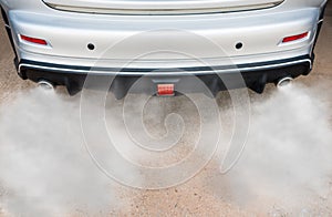 Car exhaust pipe comes out strongly of smoke