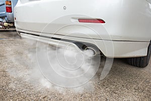 Car exhaust pipe comes out strongly of smoke, air pollution concept