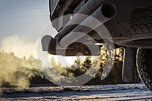 Car exhaust pipe, which comes out strongly of smoke in Finland. Focal point is the center of the photo.