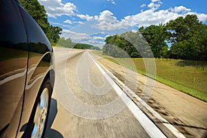 Car on the expressway on a sunny day