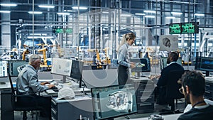 Car Factory: Team of Automotive Engineers Working, Using Computers to Design Advanced 3D Models for