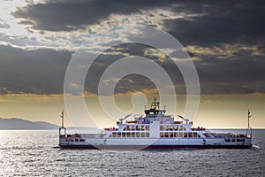 Car ferry, ferry boat on the sea, cloudy sky sunset on sea