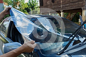 Car Films Installing wInstalling car window tint,Car Films Installing windshield protection film blur. photo