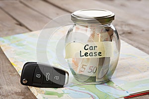 Car finance concept - money glass with word Car lease, car key